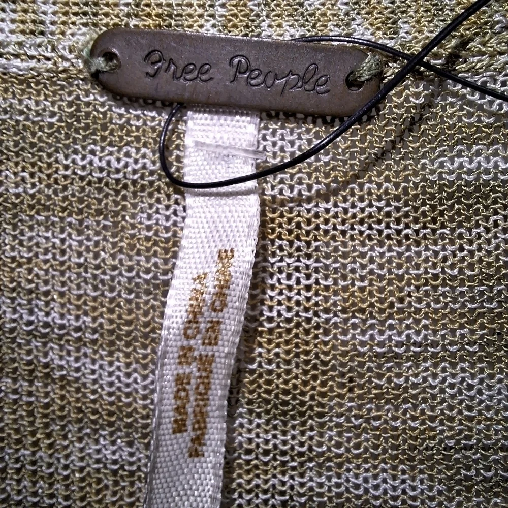 A Free People long length semi-sheer cardigan in a ladies' size XS. EUC.